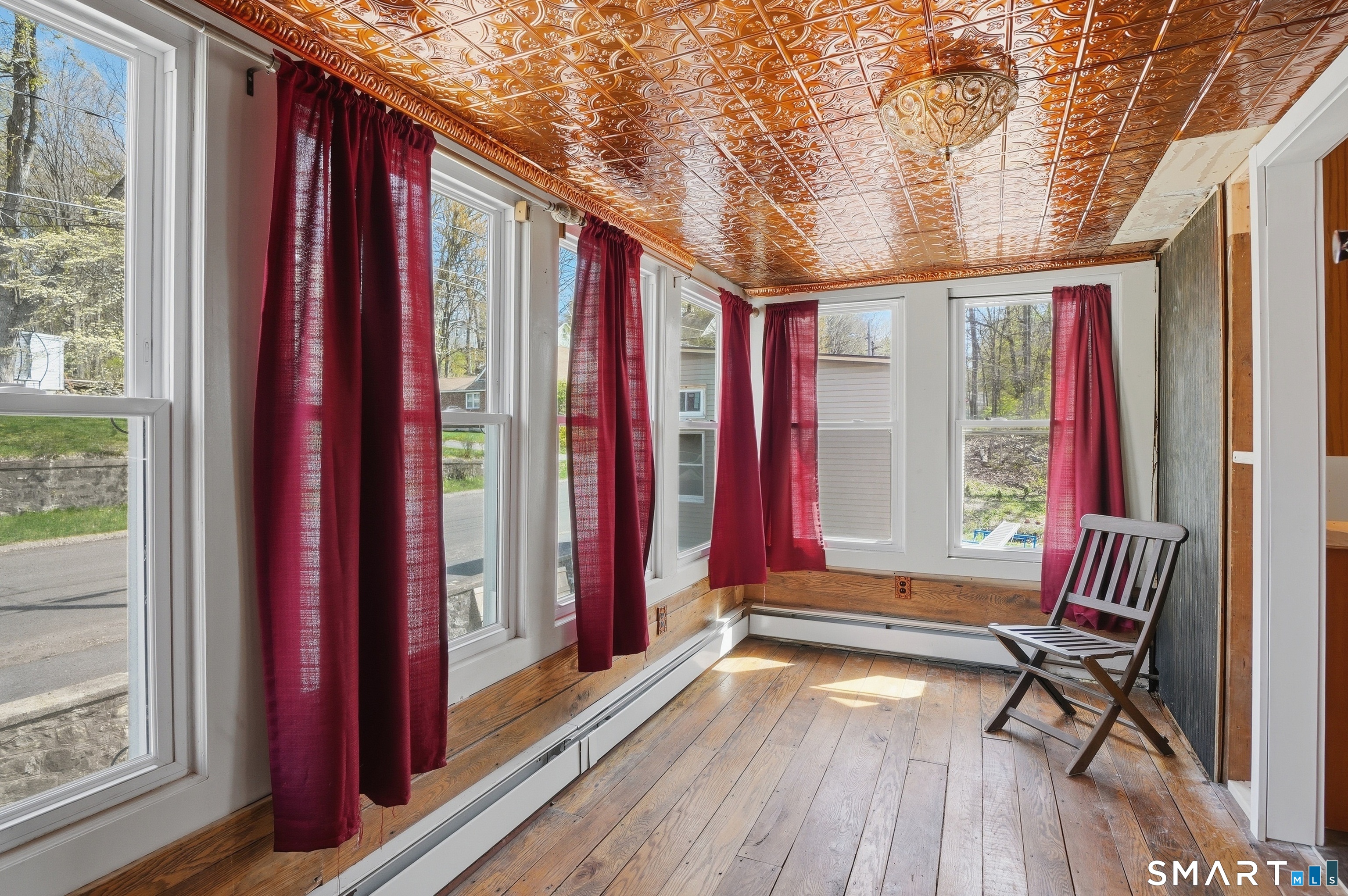 46 Pleasant Street Torrington, CT 06790 - Photo 31 of 40 a very nice looking room with a large window and wooden floor