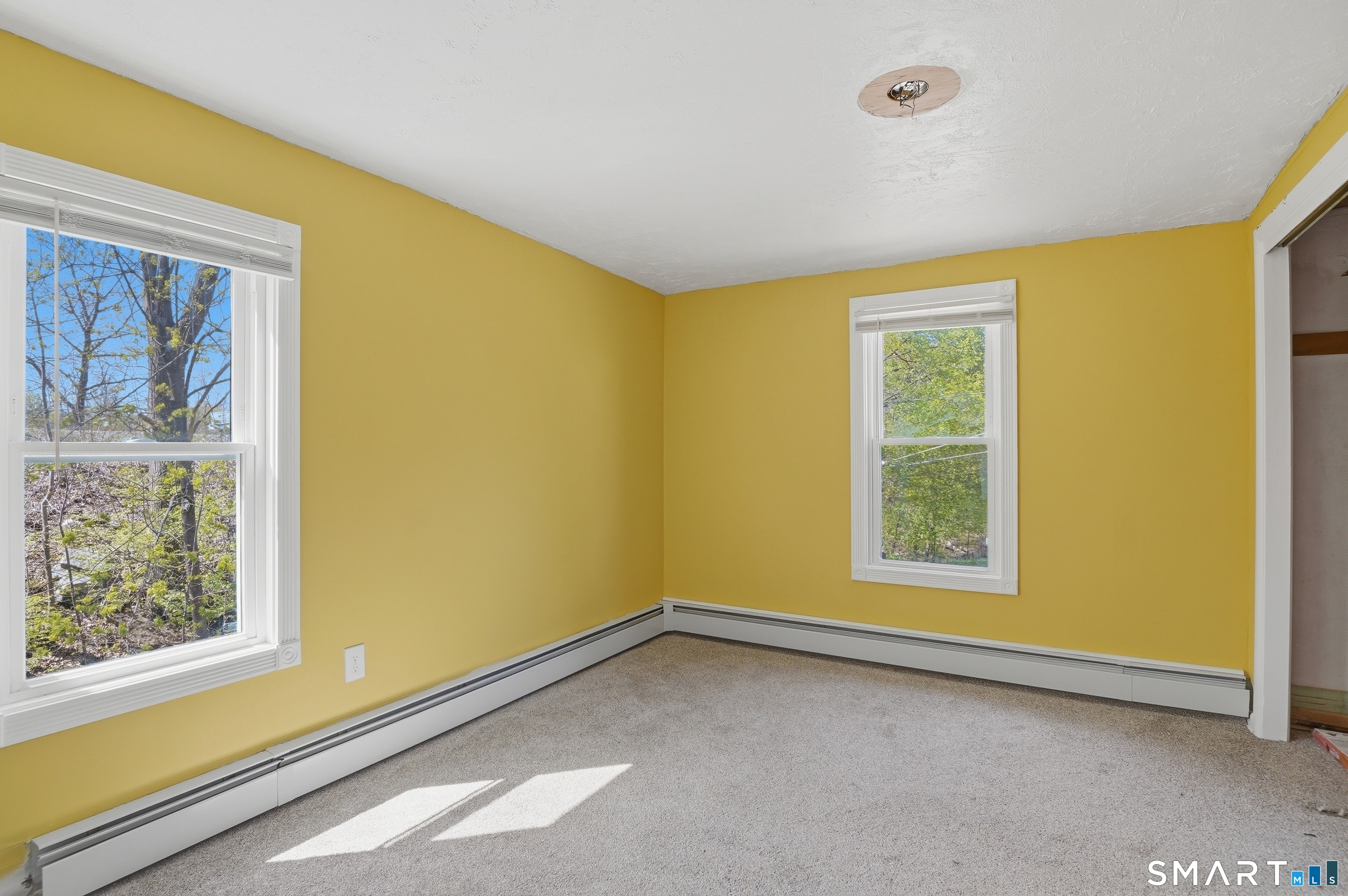 46 Pleasant Street Torrington, CT 06790 - Photo 33 of 40 a view of an empty room with a window