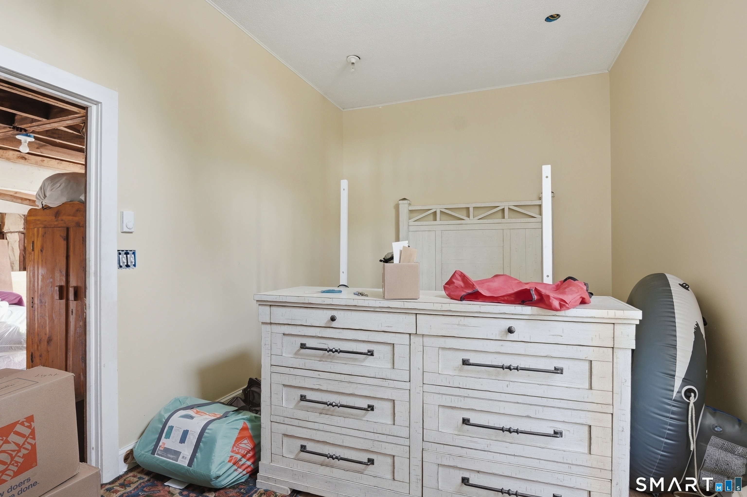46 Pleasant Street Torrington, CT 06790 - Photo 38 of 40 a room with a dresser and a closet