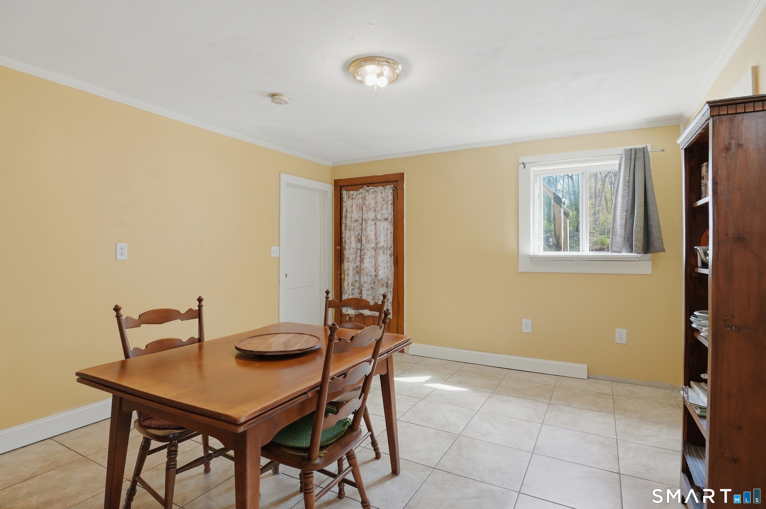 46 Pleasant Street Torrington, CT 06790 - Photo 6 of 40 a view of a dining room with furniture and window