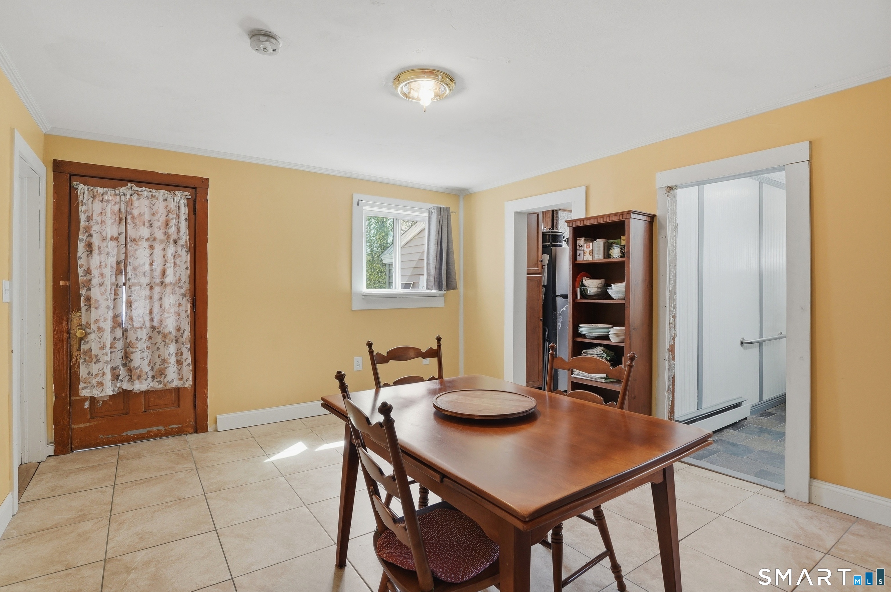 46 Pleasant Street Torrington, CT 06790 - Photo 7 of 40 a view of a dining room with furniture and chandelier