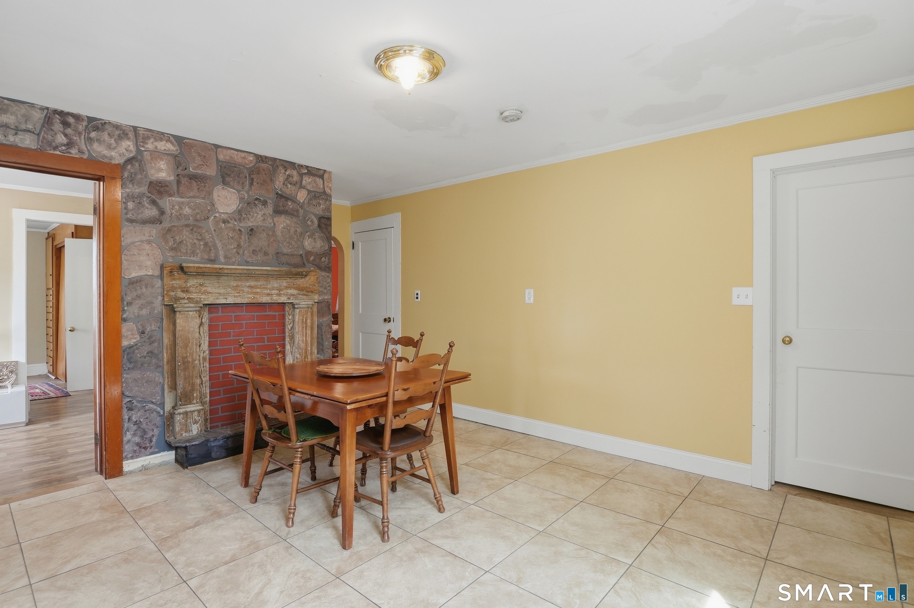 46 Pleasant Street Torrington, CT 06790 - Photo 9 of 40 a view of a dining room with furniture and chandelier
