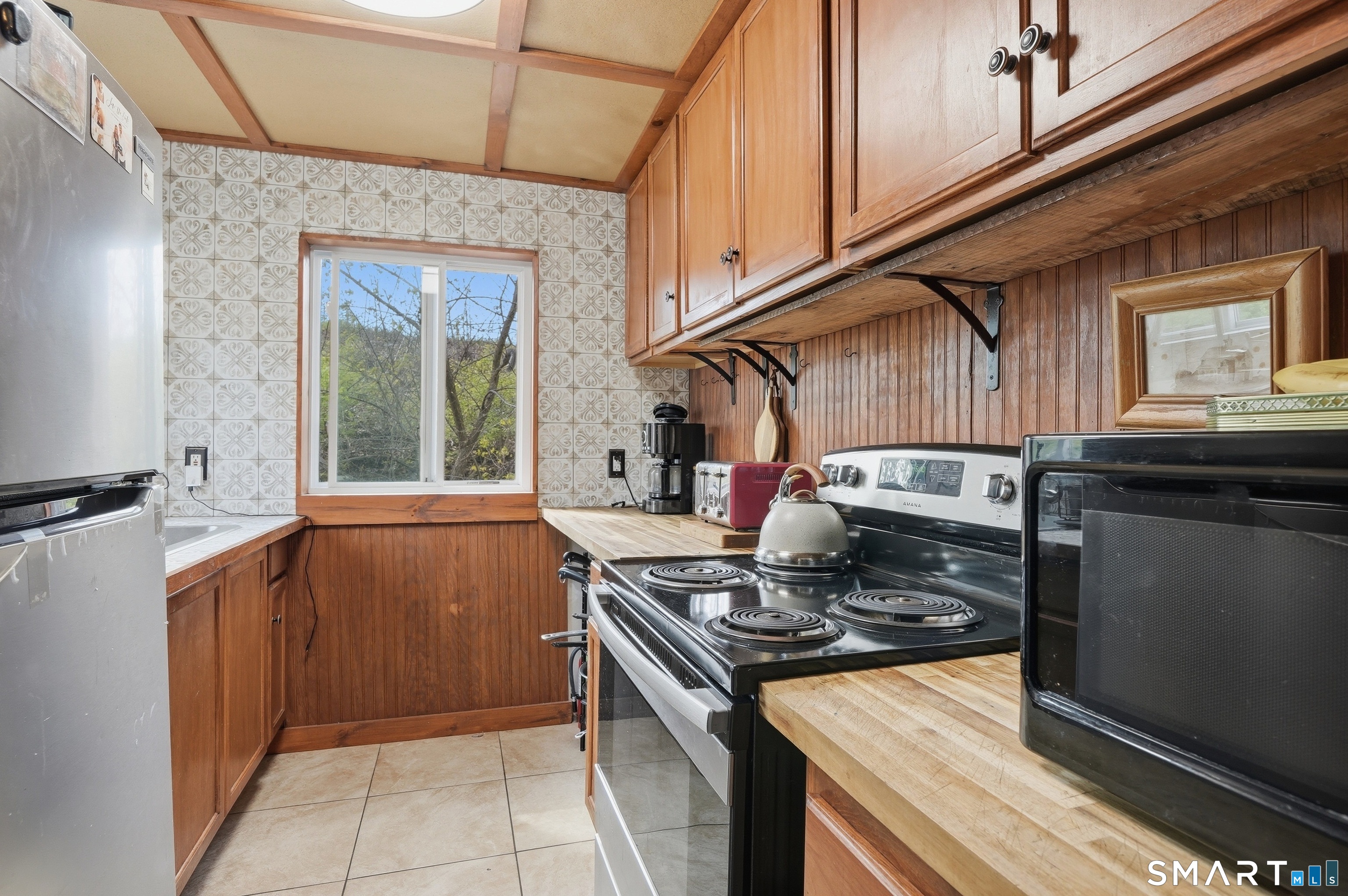 46 Pleasant Street Torrington, CT 06790 - Photo 10 of 40 a kitchen with a stove and a sink