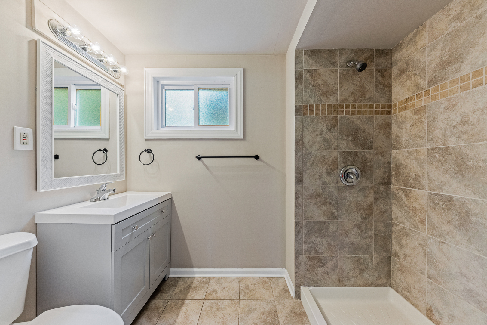 303 Springfield Street Park Forest, IL 60466 - Photo 13 of 16 a bathroom with a sink toilet and shower