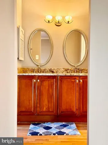 a view of a room with wooden floor