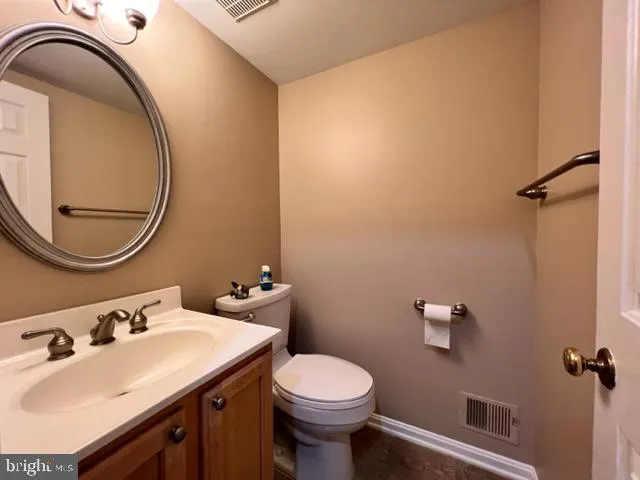 a view of a blue house with many windows