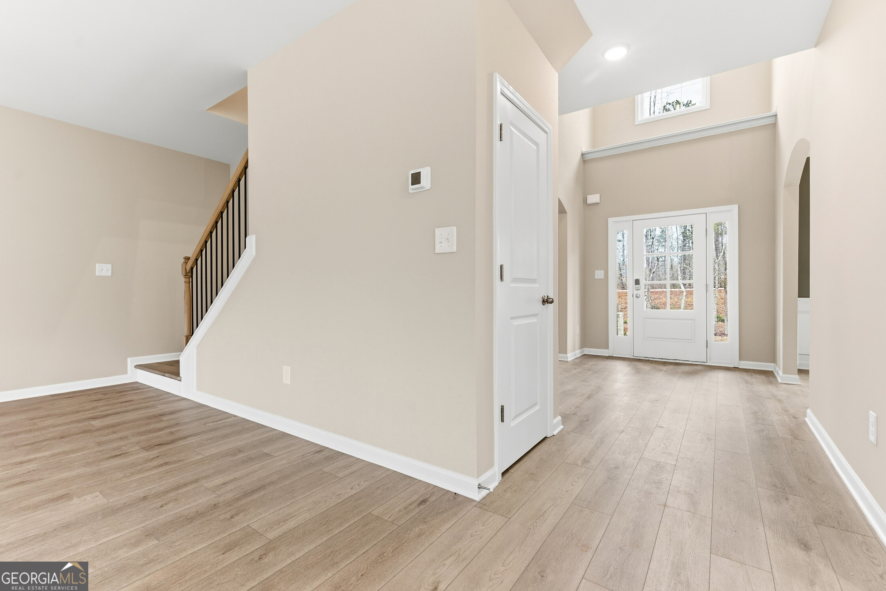 1649 Stokes Store Road, Unit 52 Forsyth, GA 31029 - Photo 18 of 73 a view of a hallway with wooden floor and entryway