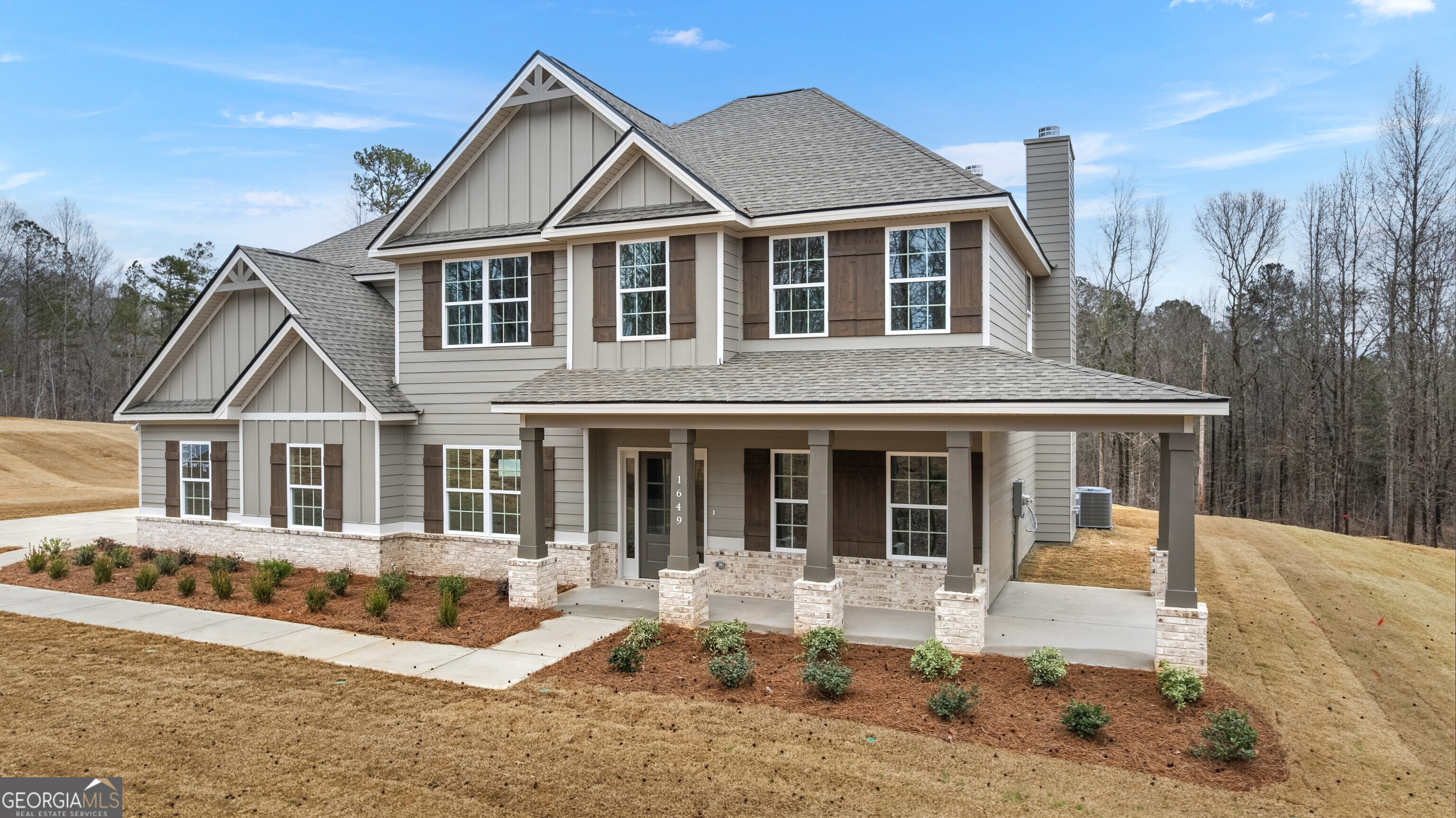 1649 Stokes Store Road, Unit 52 Forsyth, GA 31029 - Photo 2 of 73 a front view of a house with a yard