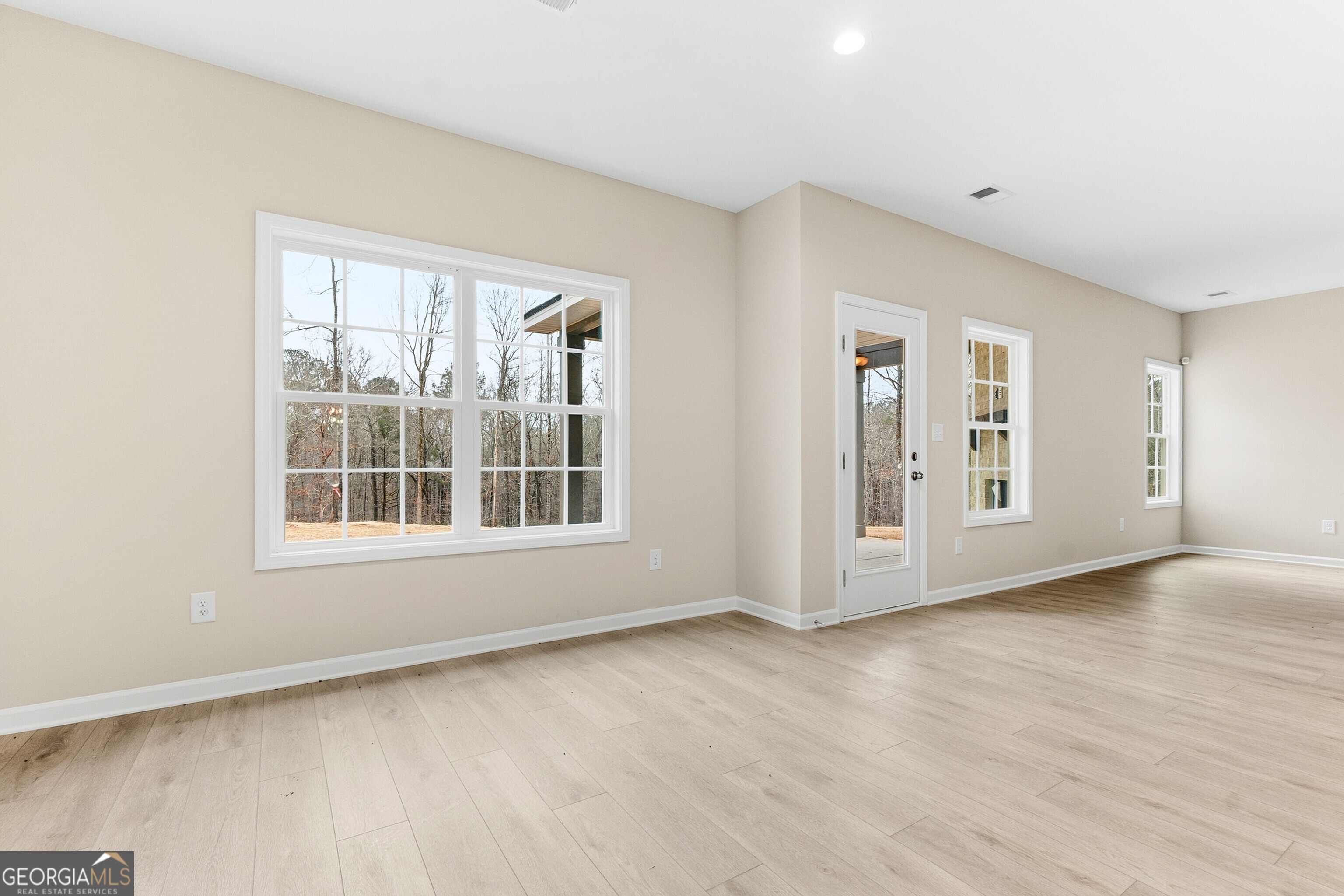 1649 Stokes Store Road, Unit 52 Forsyth, GA 31029 - Photo 22 of 73 a view of an empty room with a window