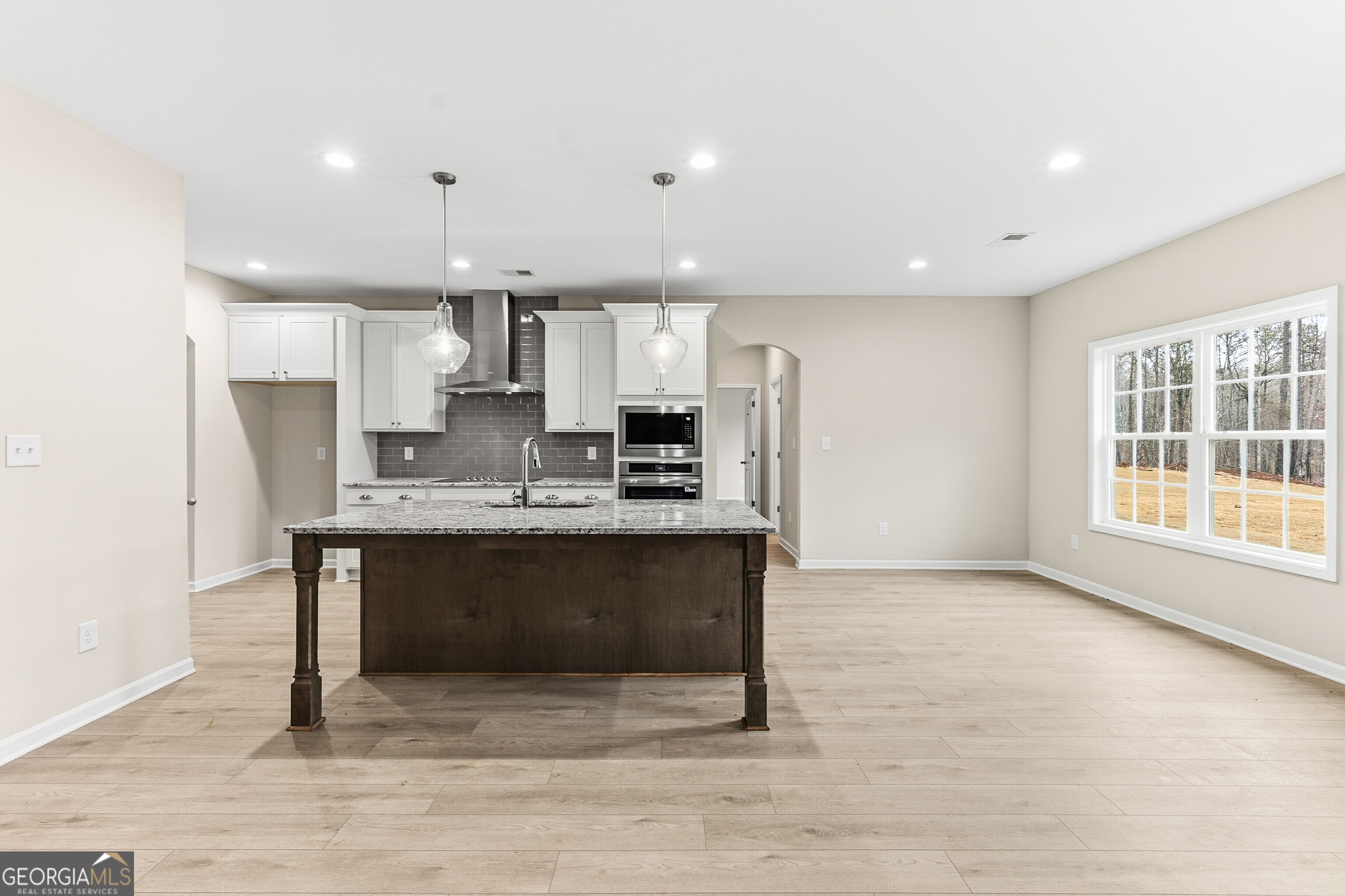 1649 Stokes Store Road, Unit 52 Forsyth, GA 31029 - Photo 23 of 73 a view of kitchen with refrigerator stove and microwave