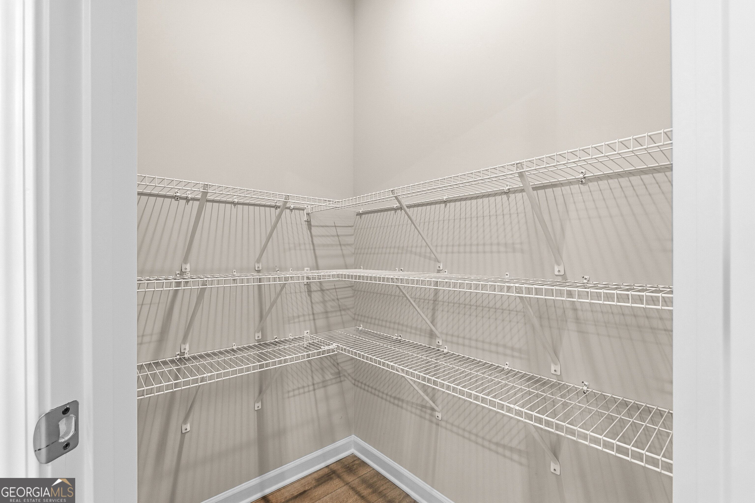 1649 Stokes Store Road, Unit 52 Forsyth, GA 31029 - Photo 33 of 73 a view of a room with racks on the wall