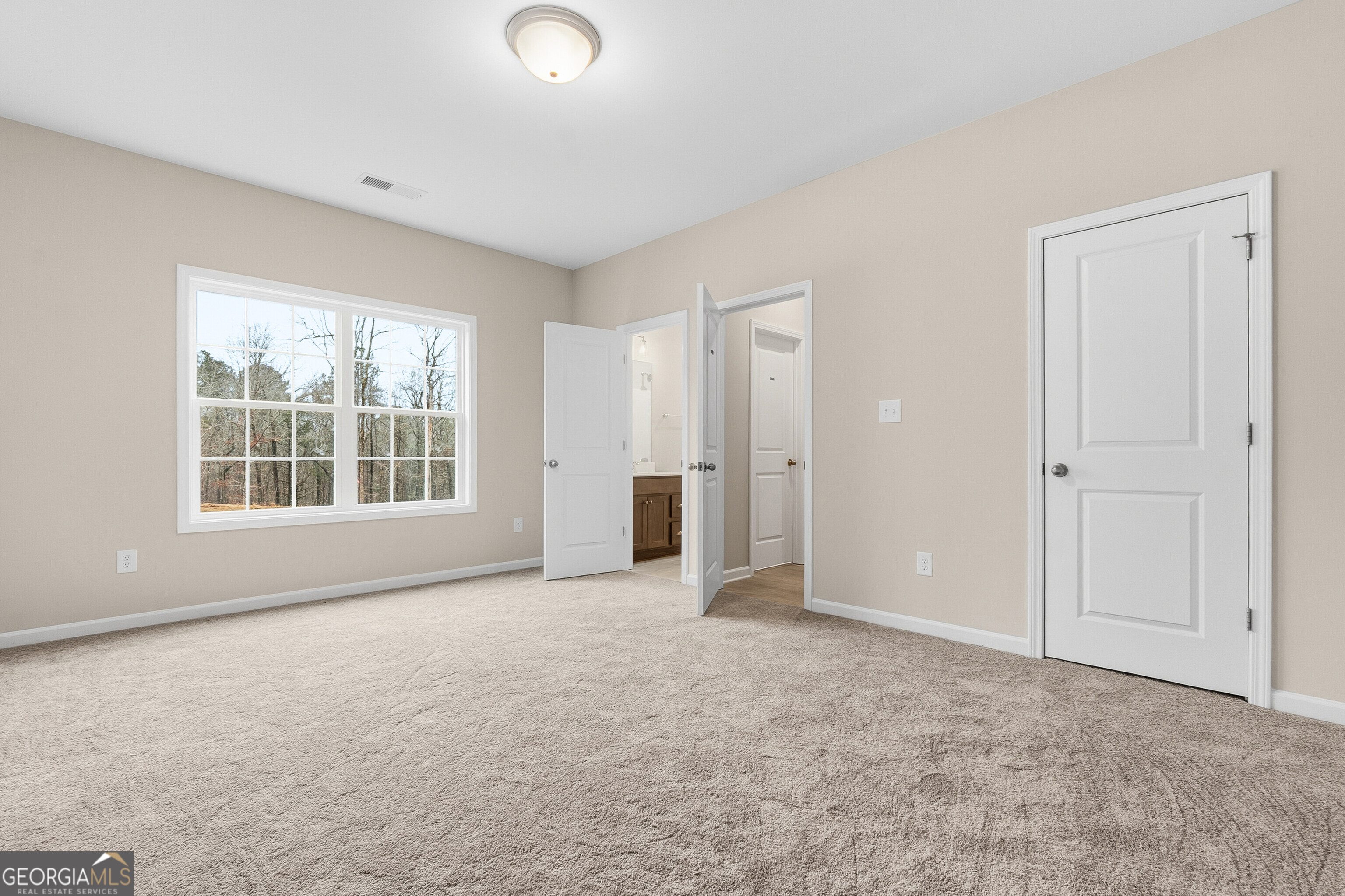 1649 Stokes Store Road, Unit 52 Forsyth, GA 31029 - Photo 35 of 73 an empty room with windows and closet