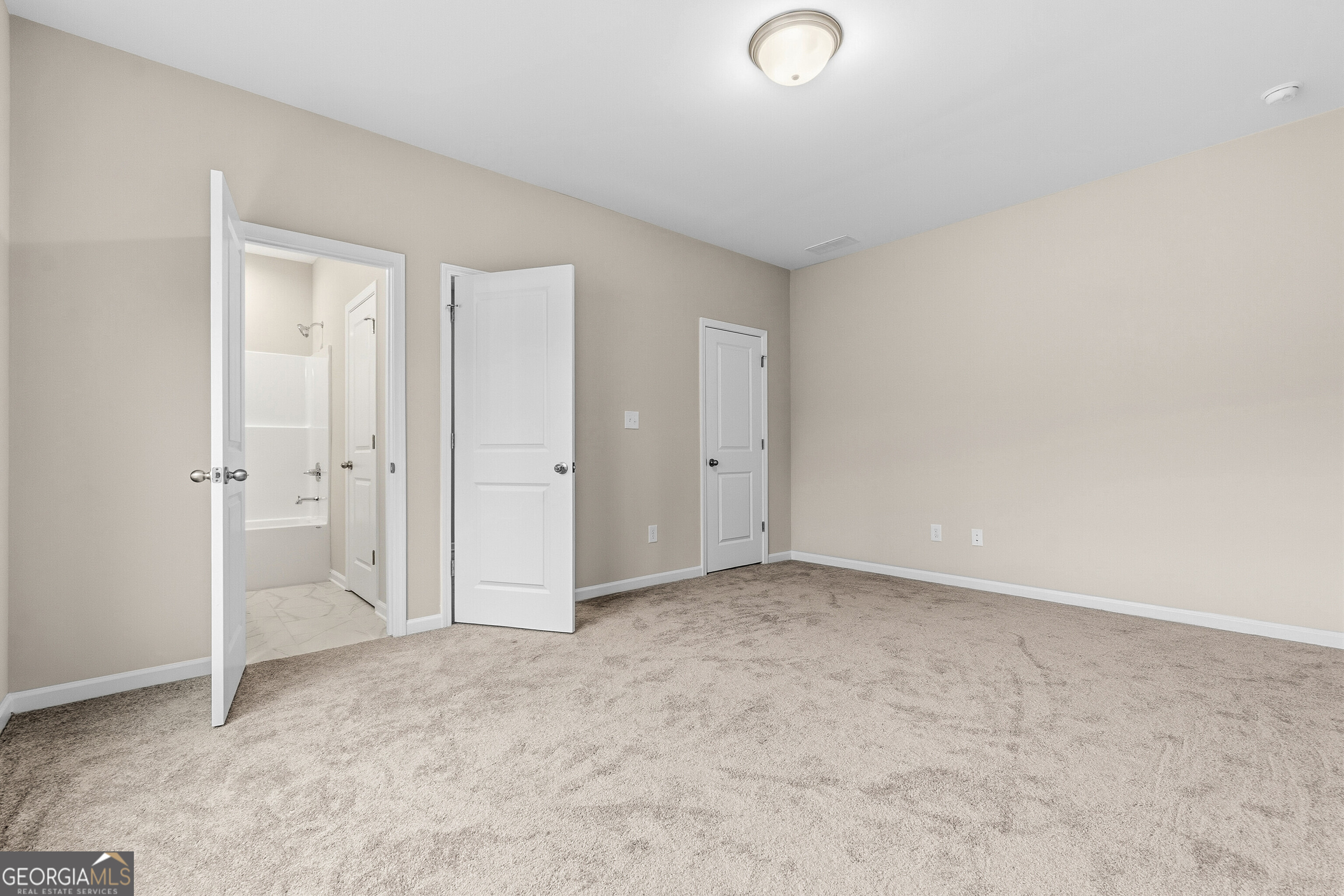 1649 Stokes Store Road, Unit 52 Forsyth, GA 31029 - Photo 37 of 73 an empty room with closet area