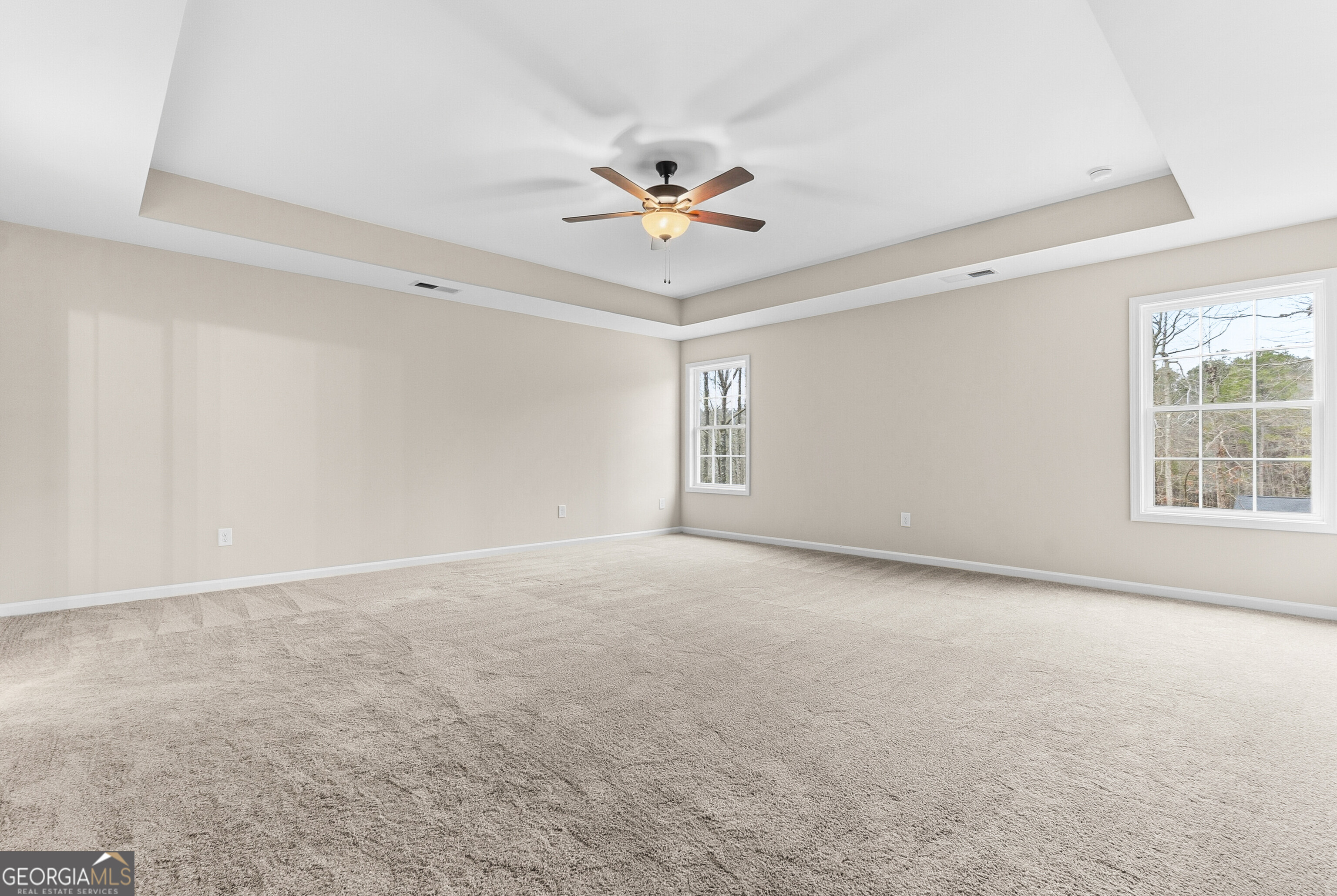 1649 Stokes Store Road, Unit 52 Forsyth, GA 31029 - Photo 40 of 73 an empty room with windows and fan