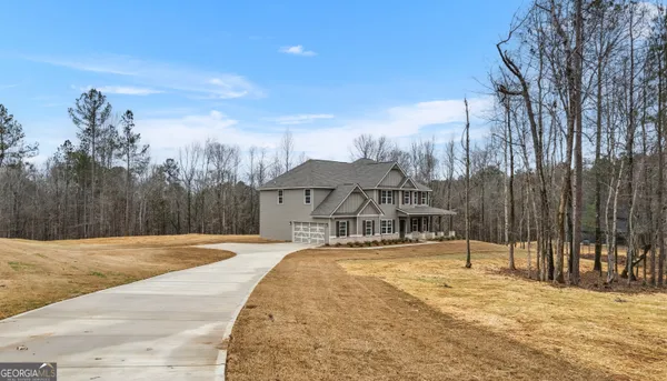a front view of a house with a yard