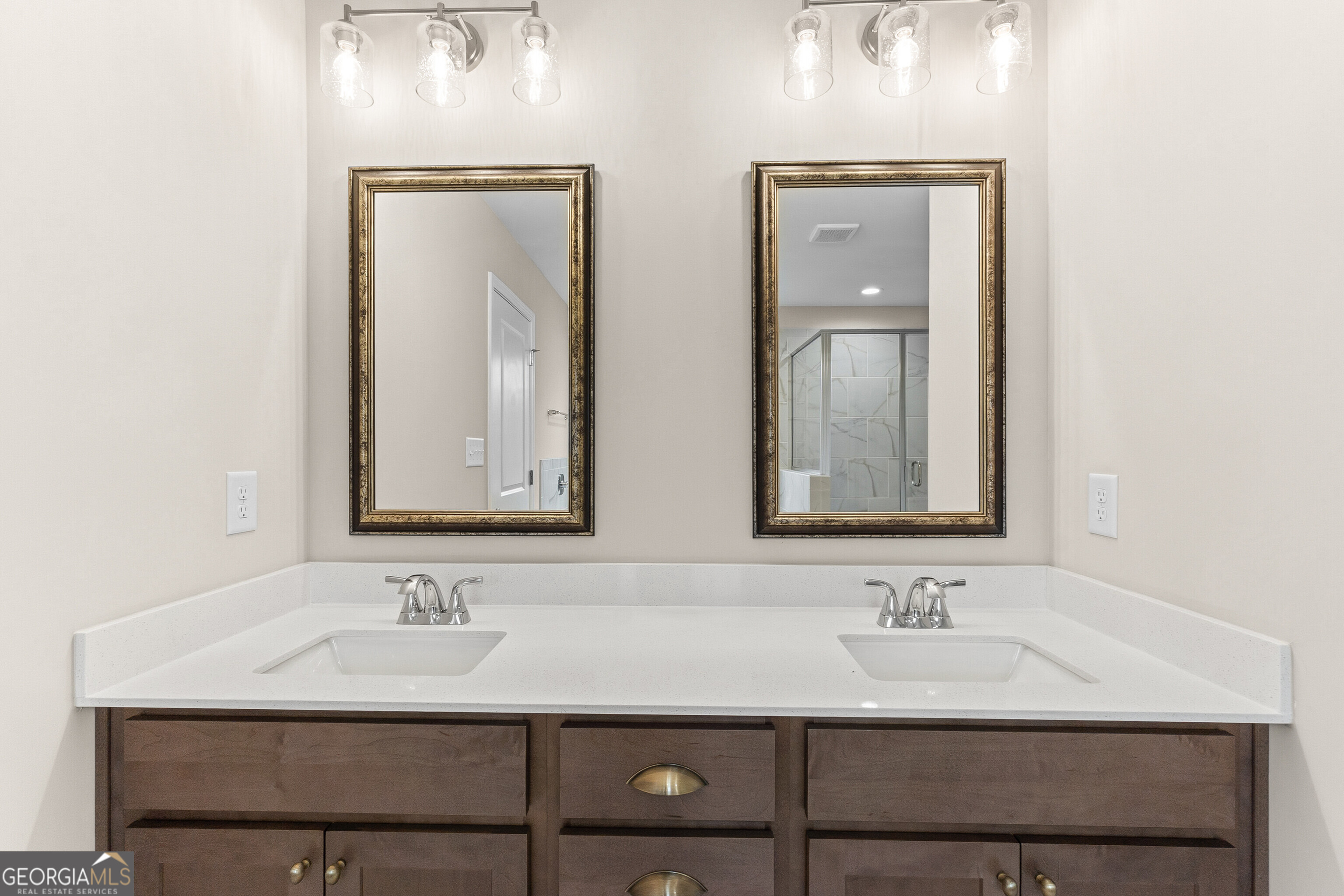 1649 Stokes Store Road, Unit 52 Forsyth, GA 31029 - Photo 45 of 73 a bathroom with 2 sink and a mirror