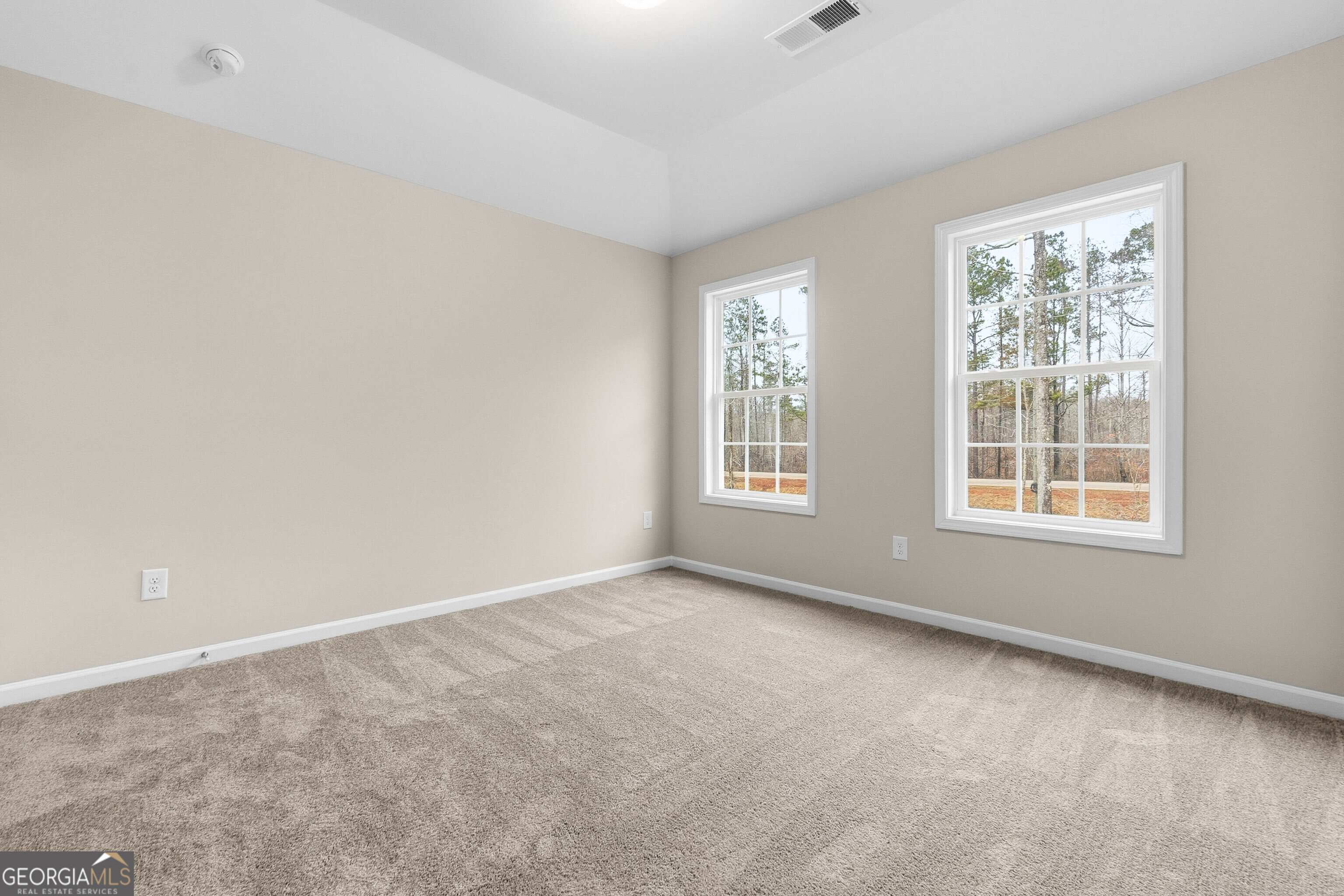 1649 Stokes Store Road, Unit 52 Forsyth, GA 31029 - Photo 50 of 73 an empty room with windows