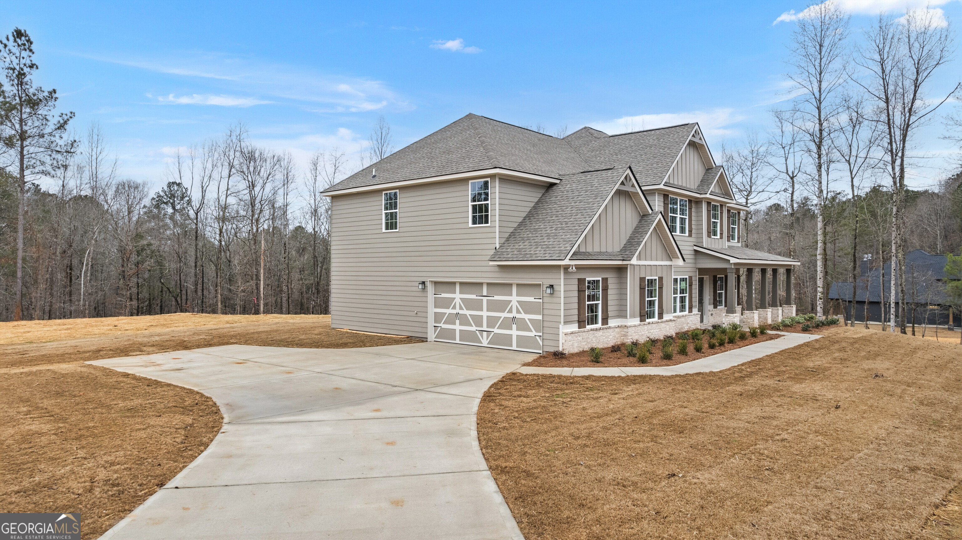 1649 Stokes Store Road, Unit 52 Forsyth, GA 31029 - Photo 5 of 73 a front view of a house with a yard