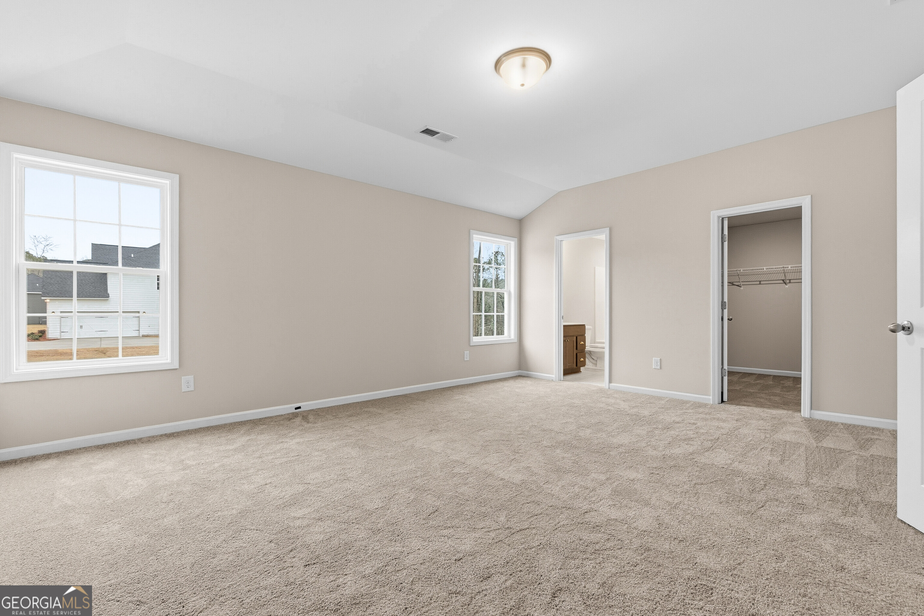 1649 Stokes Store Road, Unit 52 Forsyth, GA 31029 - Photo 55 of 73 an empty room with windows and closet