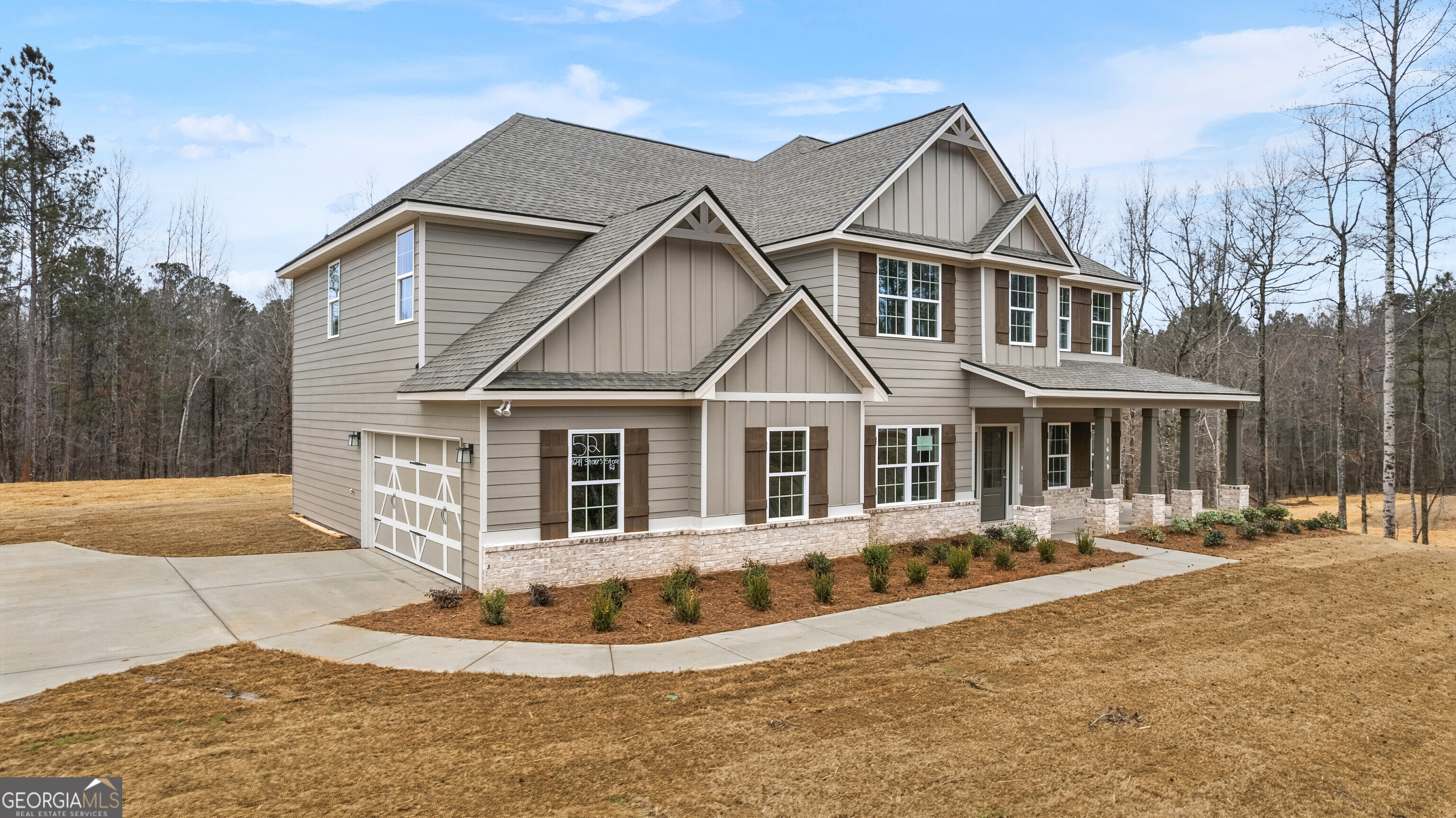 1649 Stokes Store Road, Unit 52 Forsyth, GA 31029 - Photo 6 of 73 a front view of a house with a yard