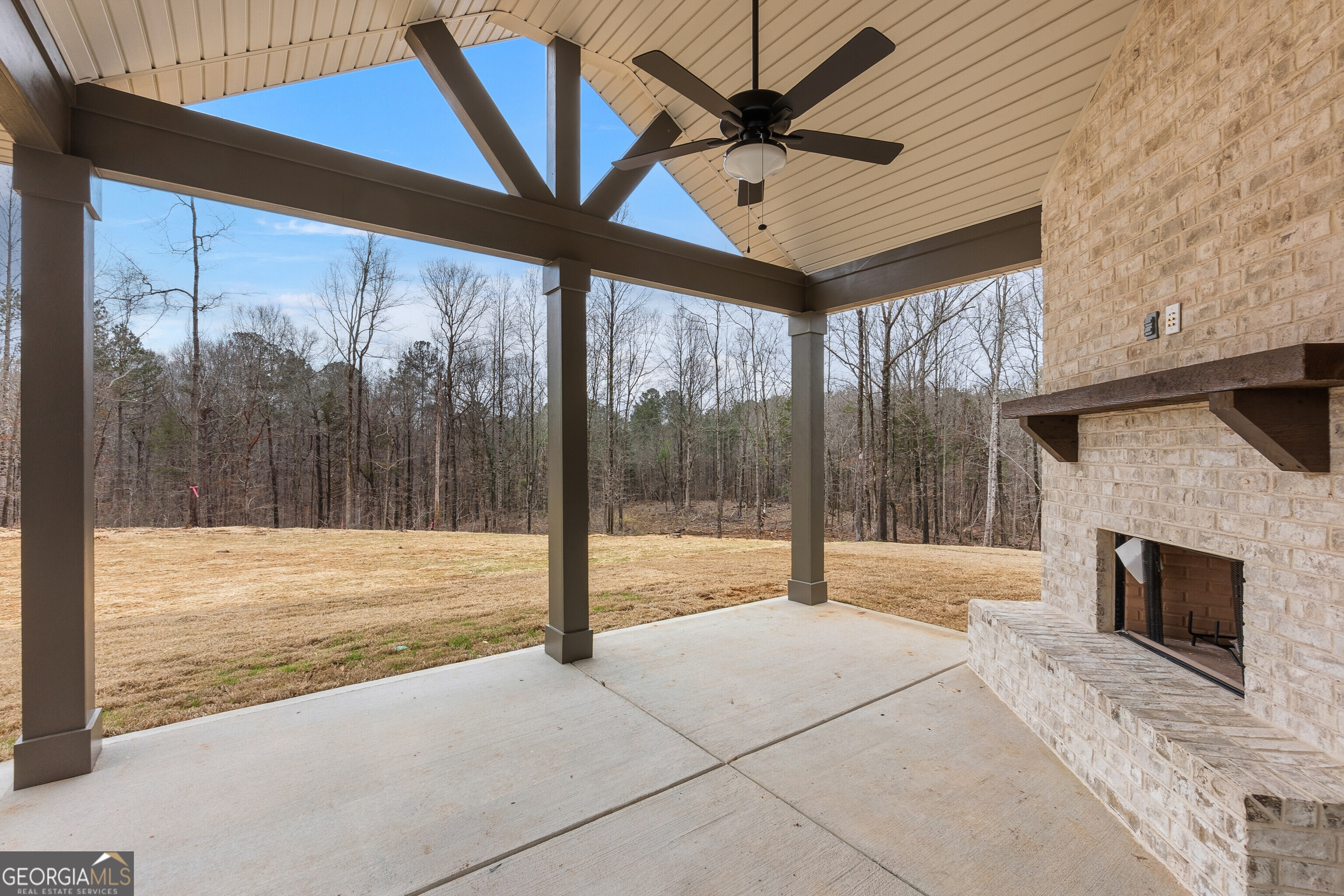 1649 Stokes Store Road, Unit 52 Forsyth, GA 31029 - Photo 61 of 73 a view of an empty room with a fireplace and a window