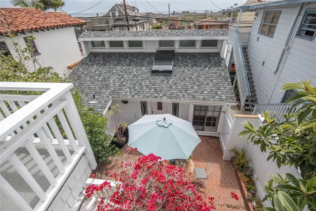 a picture of a house with a potted plant