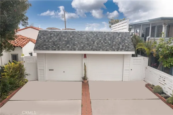 a front view of a house with garage