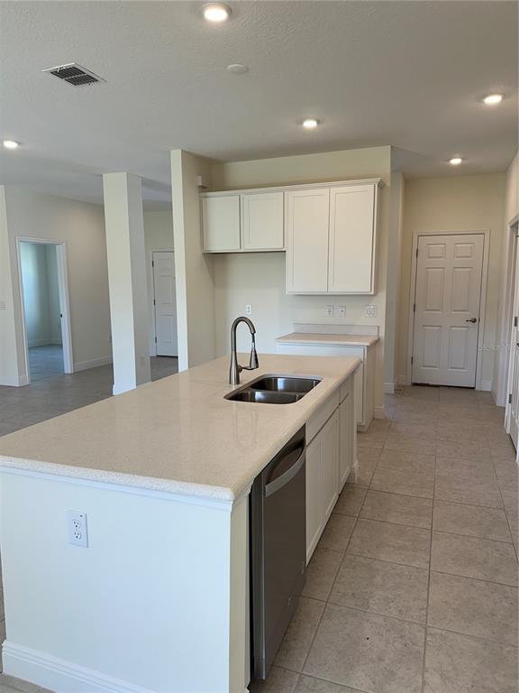 6107 Southwest 115th Street Road Ocala, FL 34476 - Photo 3 of 16 a kitchen with a sink and cabinets