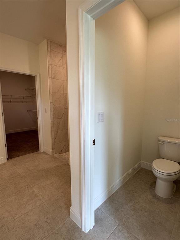 6107 Southwest 115th Street Road Ocala, FL 34476 - Photo 6 of 16 a bathroom with a toilet and a shower