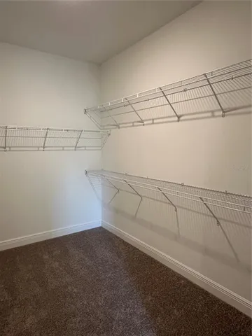 a view of a room with racks on the wall