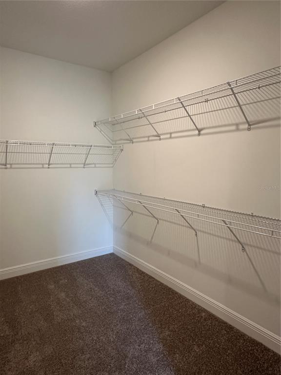 6107 Southwest 115th Street Road Ocala, FL 34476 - Photo 9 of 16 a view of a room with racks on the wall