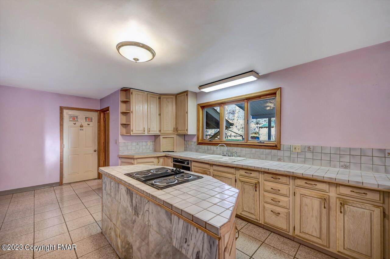 145 Gap View Circle Bushkill, PA 18324 - Photo 15 of 37 a kitchen with stainless steel appliances granite countertop a sink stove and cabinets