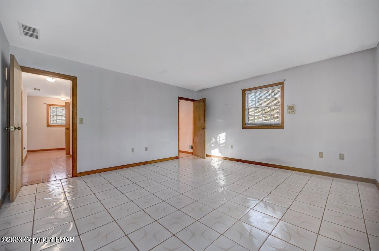 145 Gap View Circle Bushkill, PA 18324 - Photo 23 of 37 a view of an empty room and window