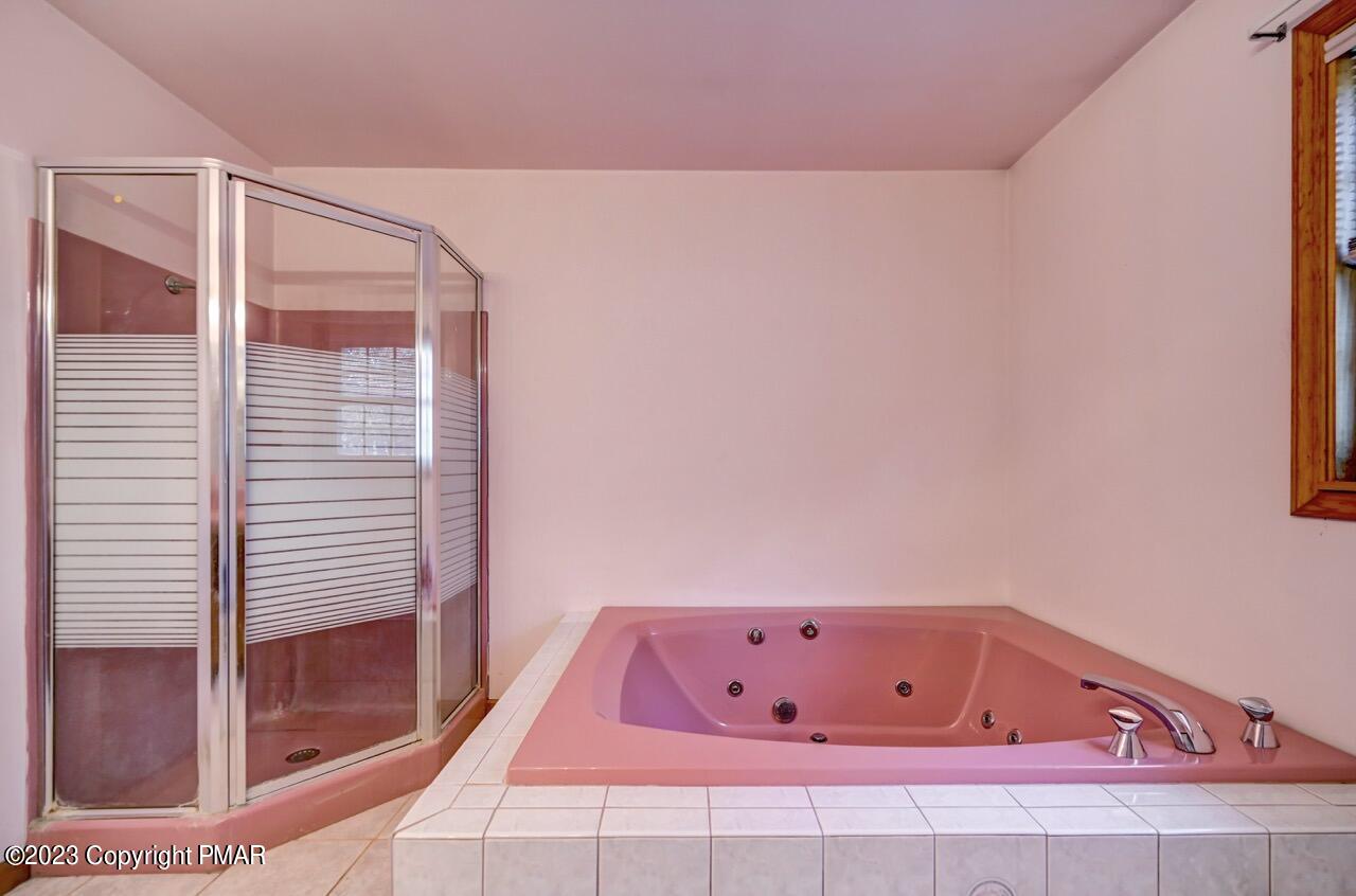 145 Gap View Circle Bushkill, PA 18324 - Photo 25 of 37 a bathroom with a bathtub and shower