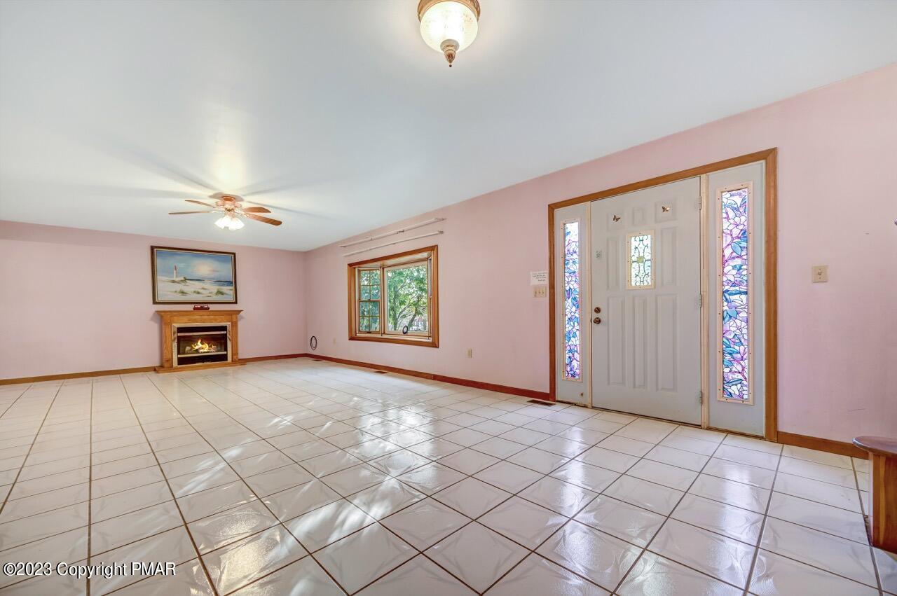 145 Gap View Circle Bushkill, PA 18324 - Photo 8 of 37 a view of an empty room with window and chandelier