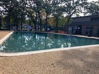 a view of swimming pool with a backyard