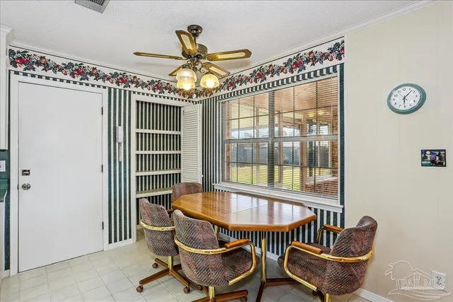 a dining room with furniture and window