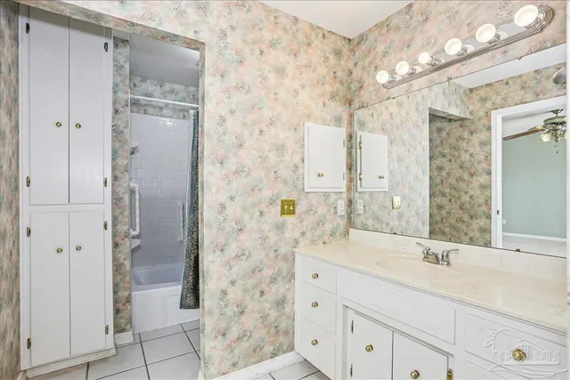 a bathroom with a shower and a sink