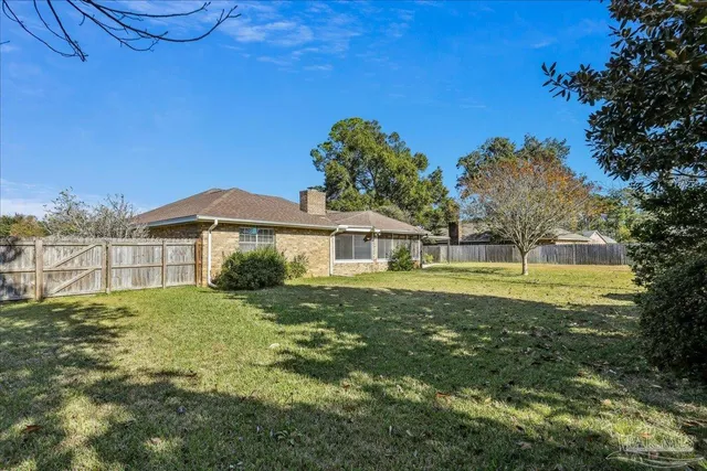 a view of a house with a big yard