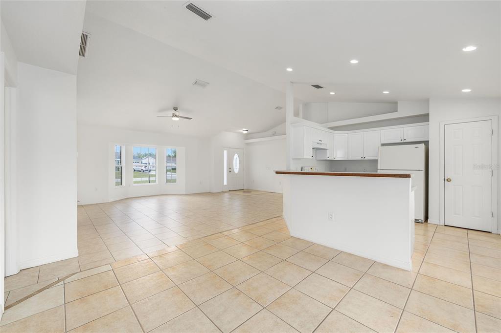 15434 Southwest 23rd Court Road Ocala, FL 34473 - Photo 16 of 41 a view of a kitchen with kitchen island and stainless steel appliances