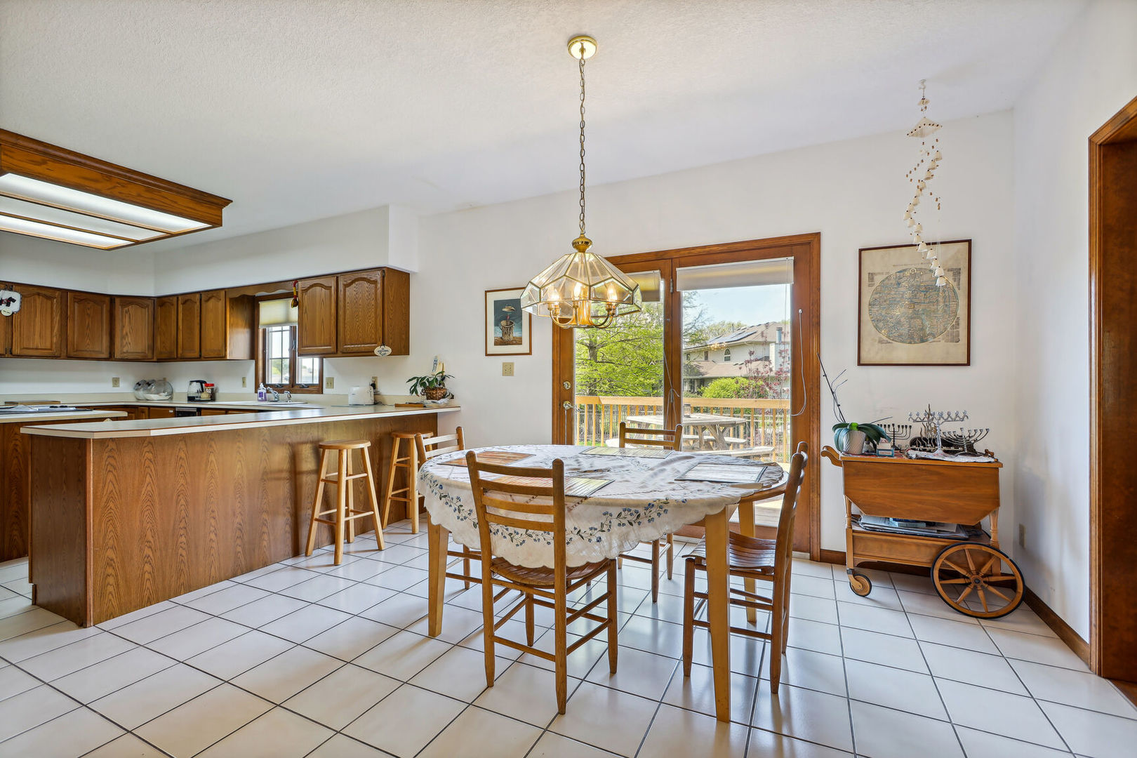 2203 Edgewater Place Champaign, IL 61822 - Photo 12 of 35 a dining table chairs and a kitchen view