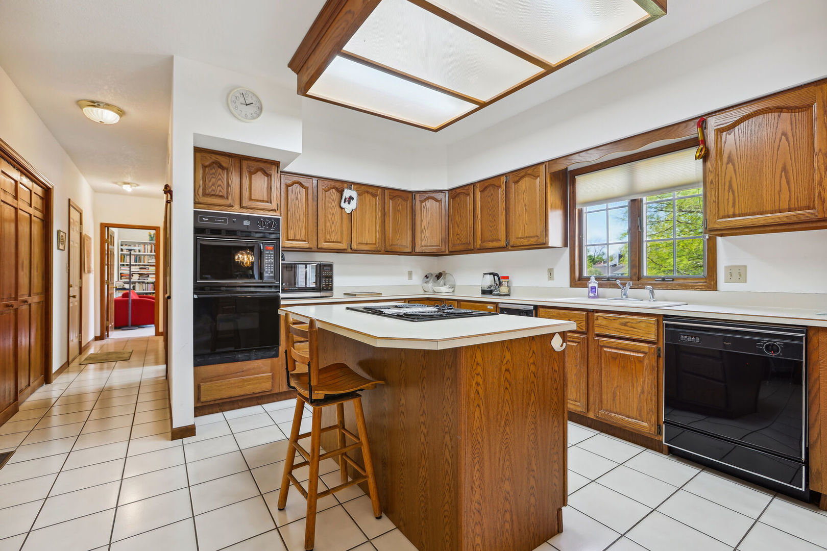 2203 Edgewater Place Champaign, IL 61822 - Photo 13 of 35 a kitchen with stainless steel appliances granite countertop a stove a sink dishwasher and a refrigerator
