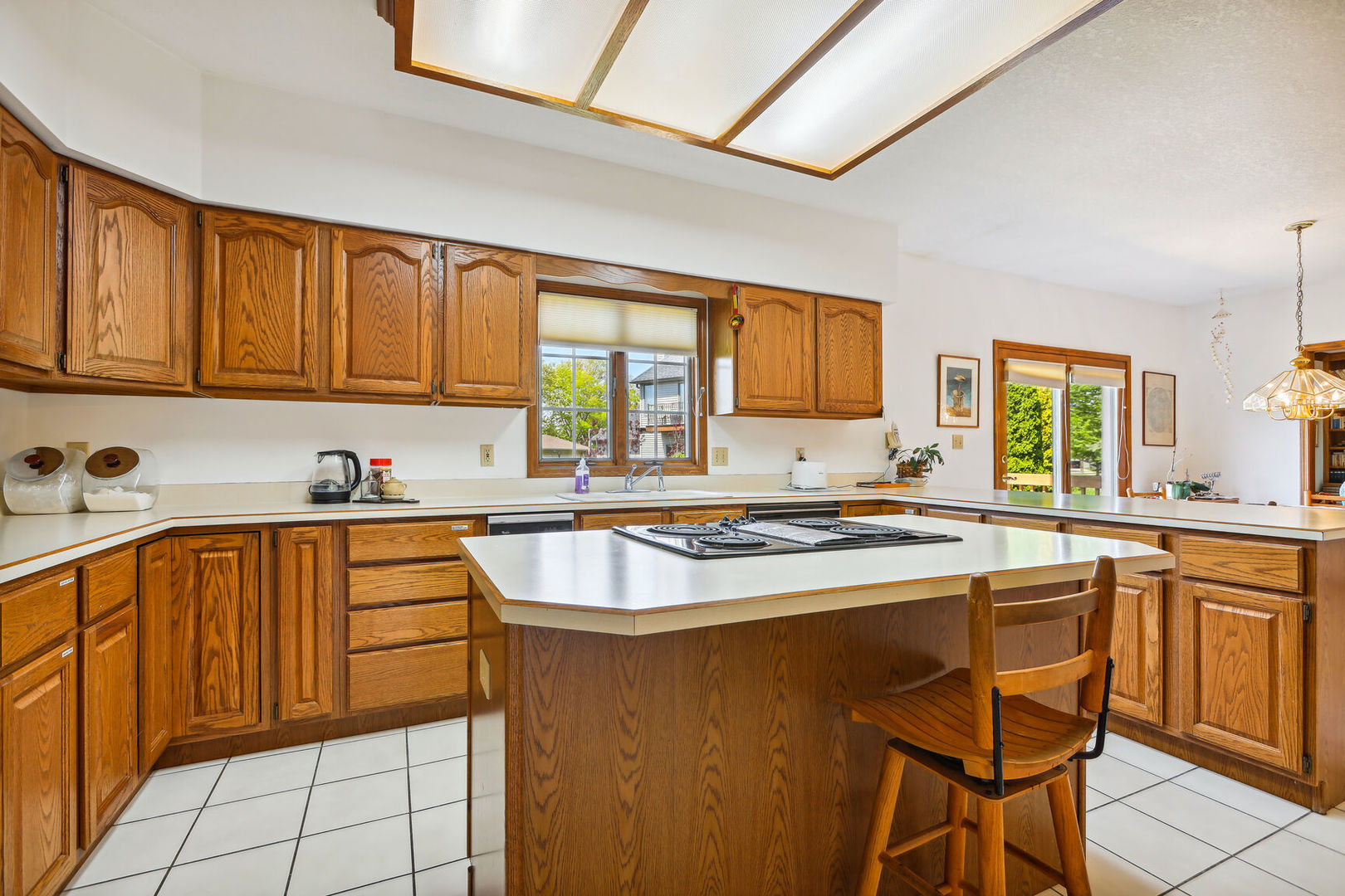 2203 Edgewater Place Champaign, IL 61822 - Photo 14 of 35 a kitchen with stainless steel appliances granite countertop a sink stove and cabinets
