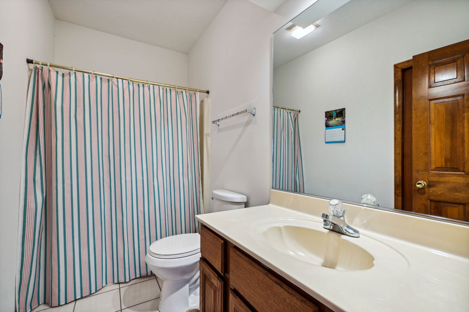2203 Edgewater Place Champaign, IL 61822 - Photo 20 of 35 a bathroom with a sink a toilet and mirror
