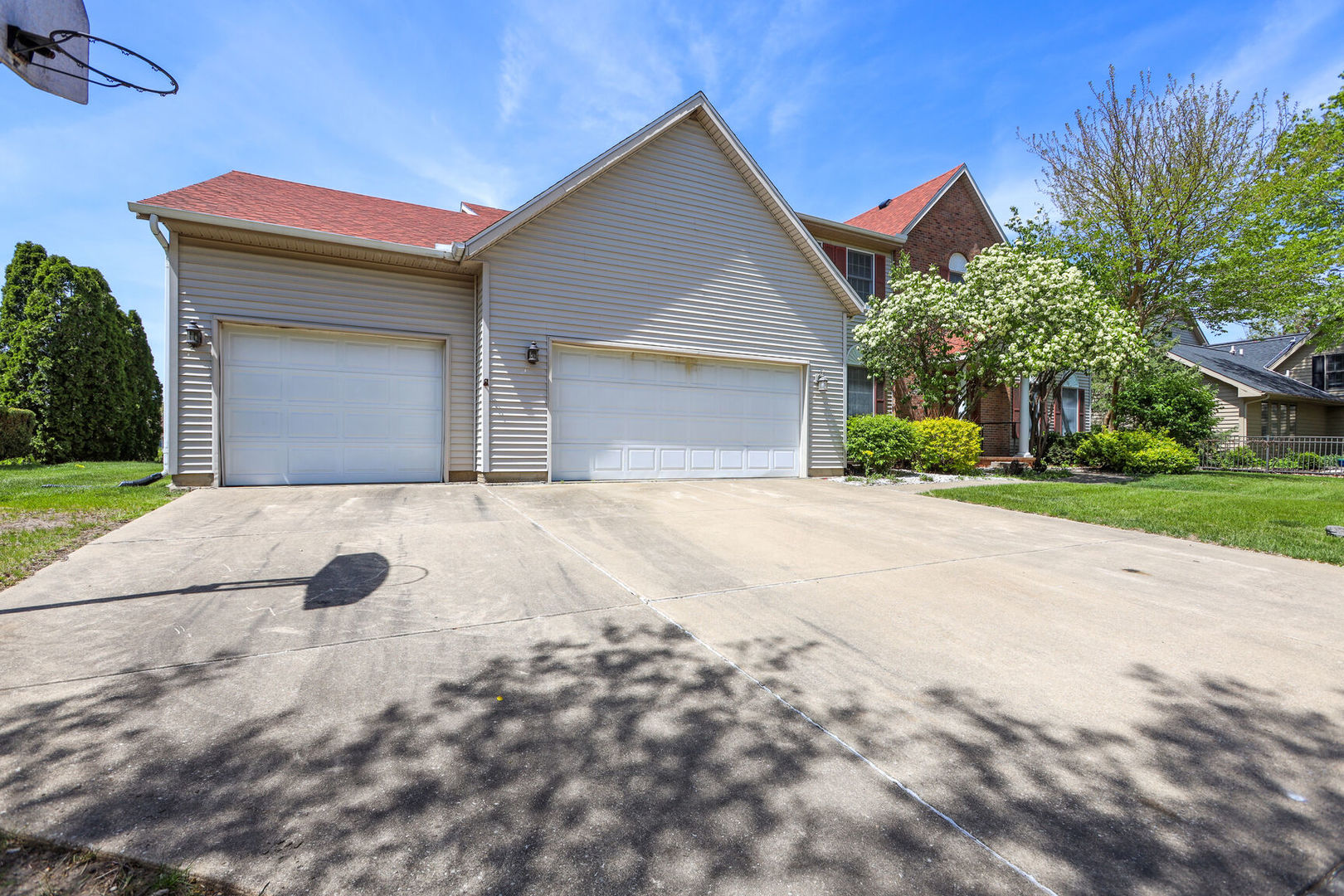 2203 Edgewater Place Champaign, IL 61822 - Photo 2 of 35 a front view of a house with a yard and garage