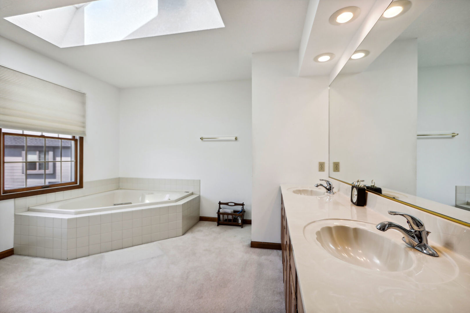 2203 Edgewater Place Champaign, IL 61822 - Photo 24 of 35 a bathroom with a tub a sink and mirror