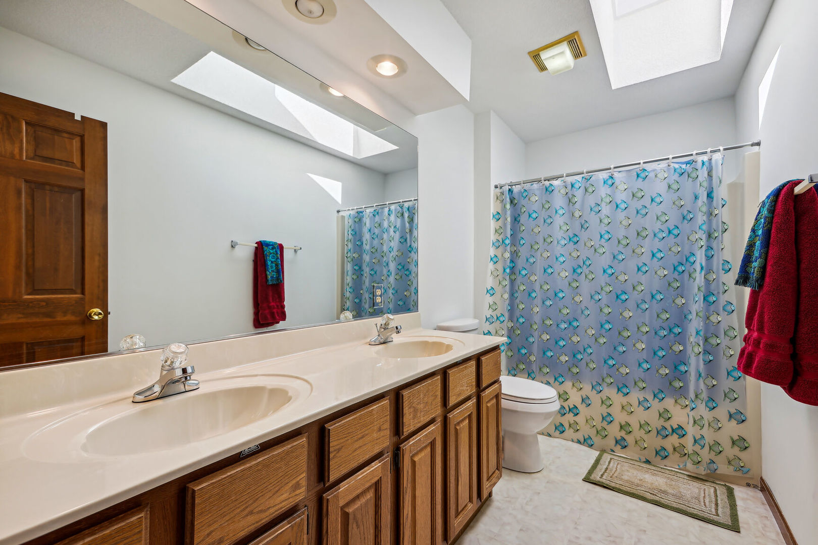 2203 Edgewater Place Champaign, IL 61822 - Photo 26 of 35 a bathroom with a sink toilet double vanity and shower