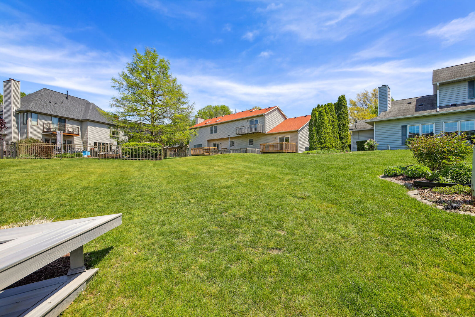 2203 Edgewater Place Champaign, IL 61822 - Photo 34 of 35 a front view of a house with a yard table and chairs
