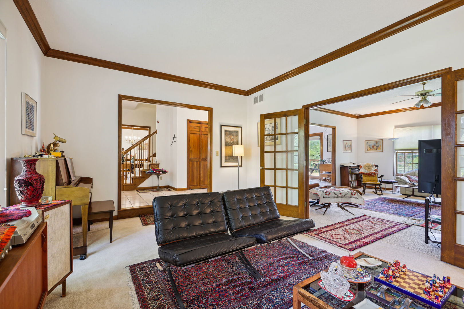 2203 Edgewater Place Champaign, IL 61822 - Photo 7 of 35 a living room with furniture a flat screen tv and a floor to ceiling window
