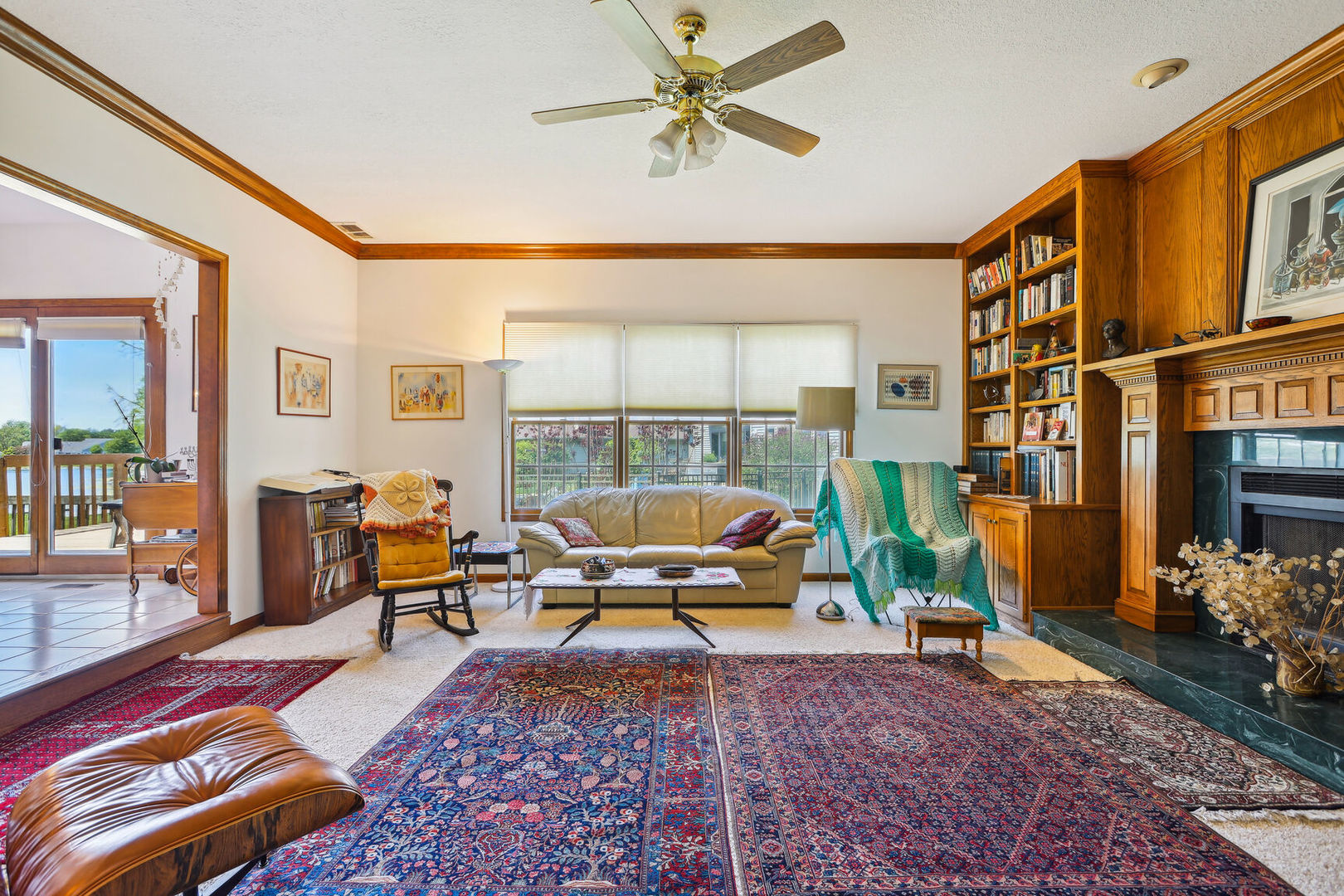 2203 Edgewater Place Champaign, IL 61822 - Photo 8 of 35 a living room with furniture a rug and a chandelier